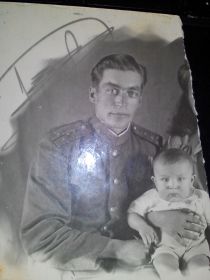 Мой дед - Василий, держит на руках моего отца Вадим.