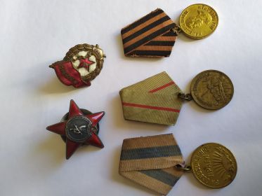 Орден "Красной Звезды" и медалью за оборону Сталинграда и медалью за освобождение Праги