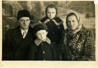 Муж Дмитрий, дети - Валя и Дима, и сама Александра