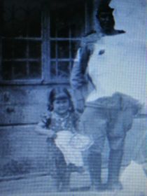 На фотографии Александр Игнатьевич изображен  во время военных действий в Австрии.  Эту  девочку он спас  во время бомбёжки.