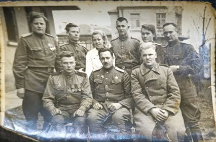 Василий сидит слева.